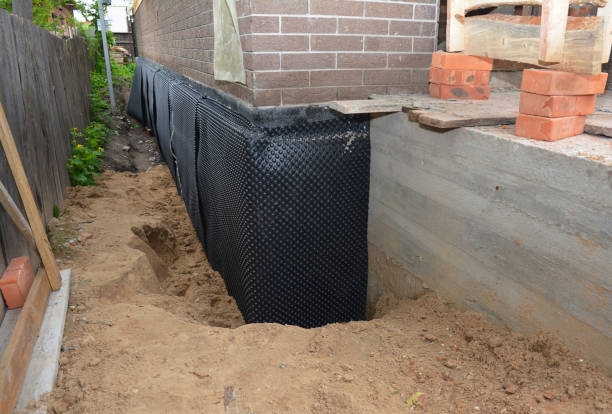 Happy homeowners after waterproofing job in Township Of Washington